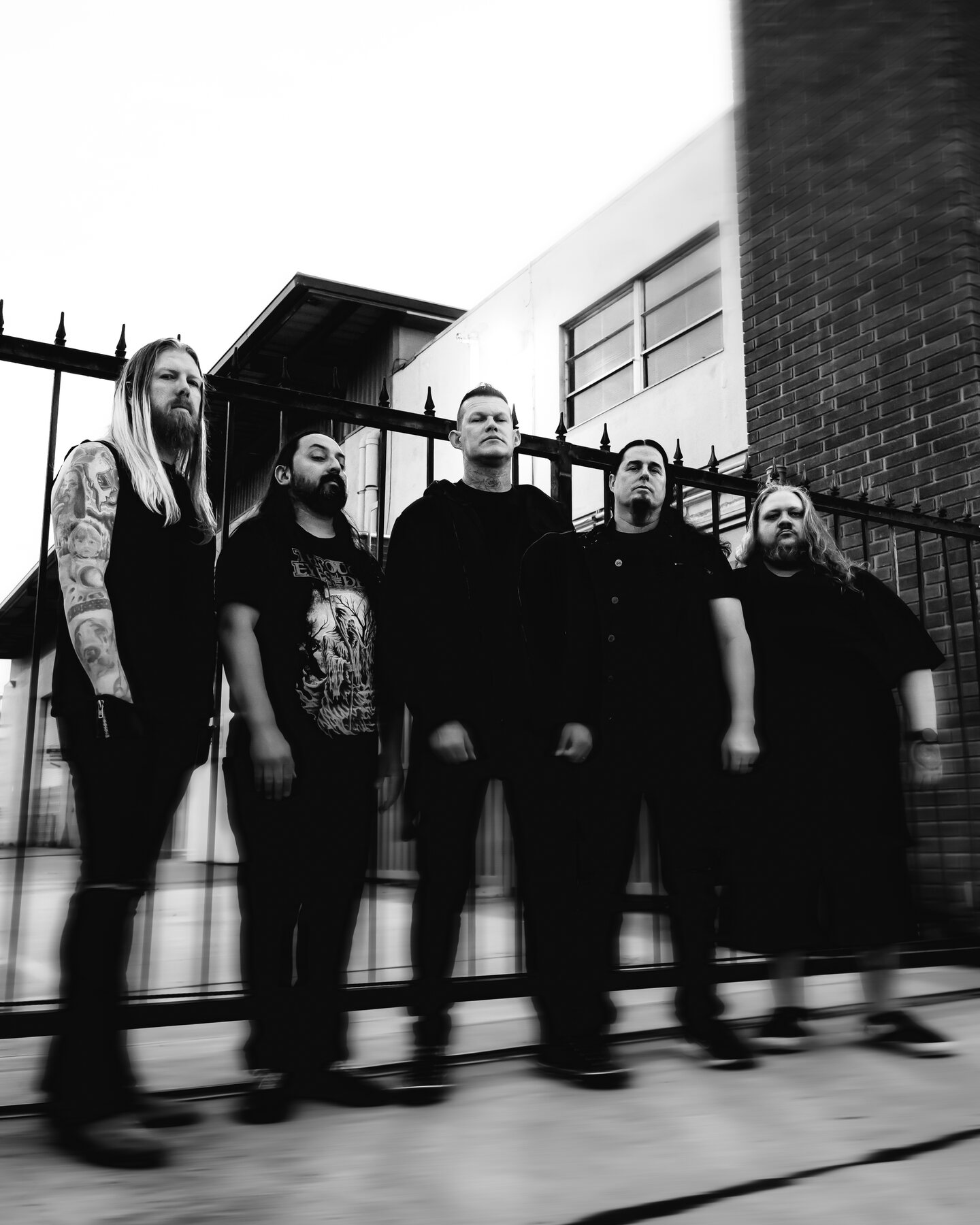 The five members of Carnifex standing outside in an official black-and-white press photo