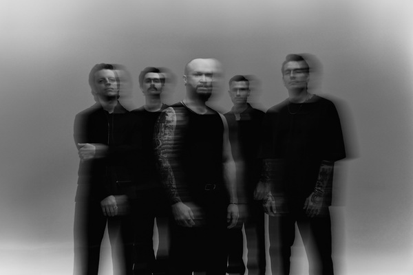 Black-and-white promotional portrait of We Came As Romans with a blurred double-exposure effect